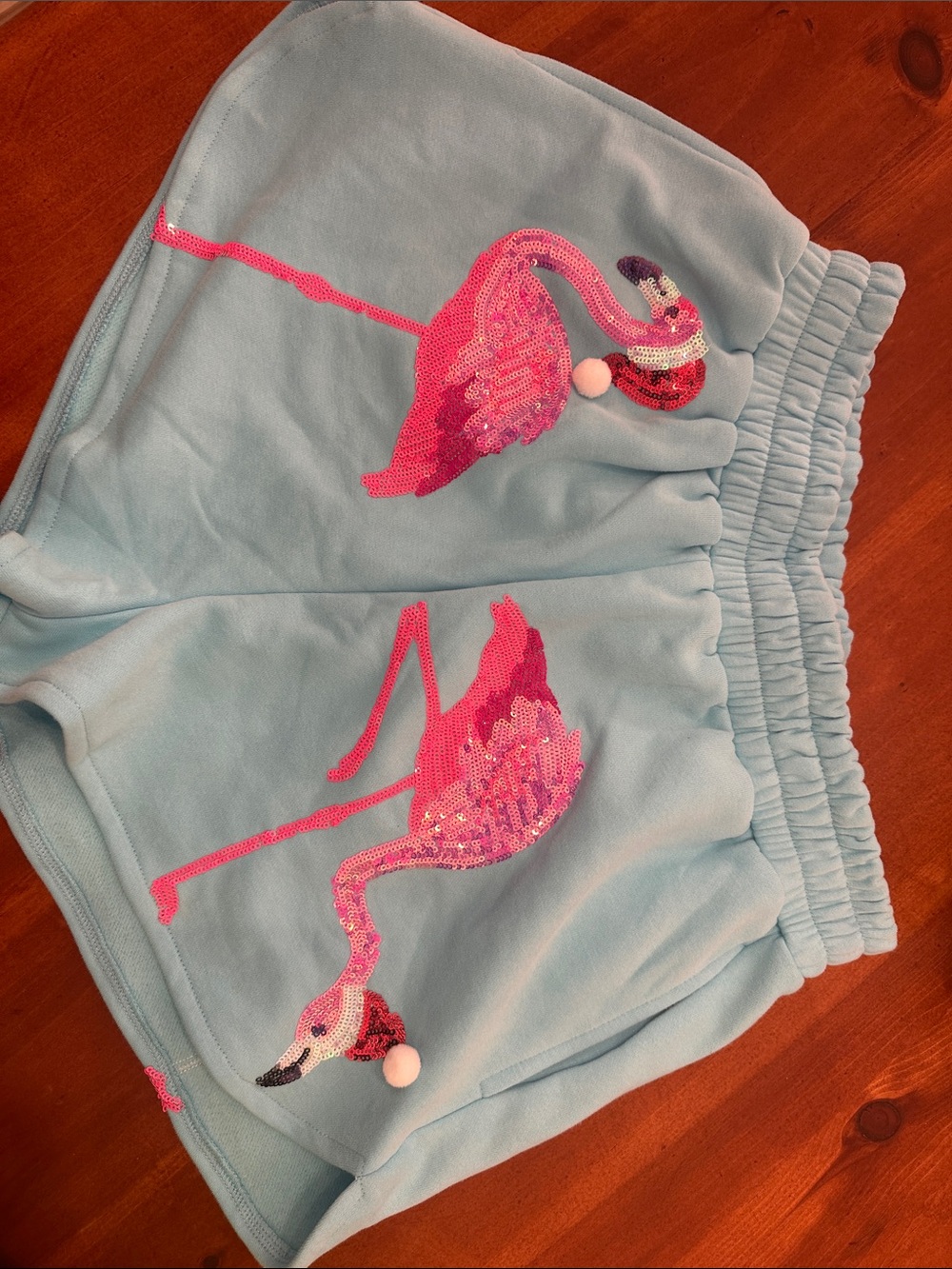 Queen of Sparkles flamingo Santa shorts